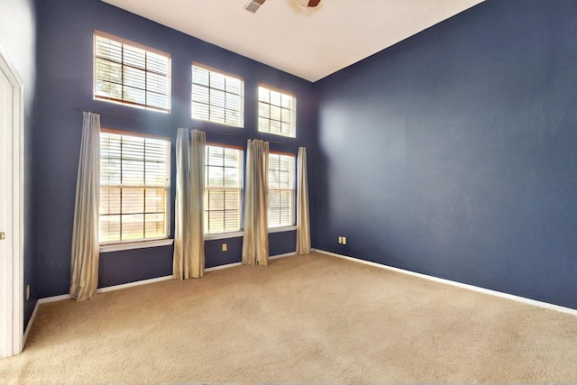8720 Oakcrest Pl NW, Albuquerque, NM 87114 - carpeted empty room featuring a ceiling fan and baseboards