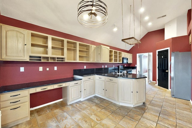 8720 Oakcrest Pl NW, Albuquerque, NM 87114 - kitchen featuring freestanding refrigerator, open shelves, black microwave, dark countertops, and stove