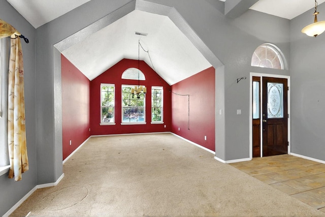 8720 Oakcrest Pl NW, Albuquerque, NM 87114 - carpeted foyer with baseboards and high vaulted ceiling