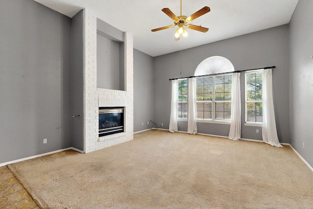 8720 Oakcrest Pl NW, Albuquerque, NM 87114 - unfurnished living room featuring plenty of natural light, a ceiling fan, a brick fireplace, and baseboards