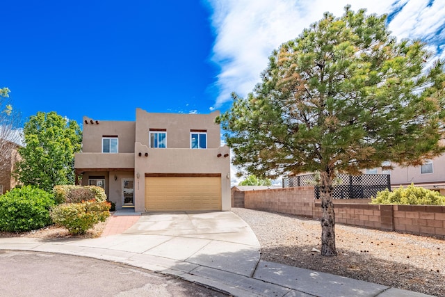 10500 Trieste Ct NW, Albuquerque, NM 87114 - adobe home with stucco siding, driveway, fence, and an attached garage