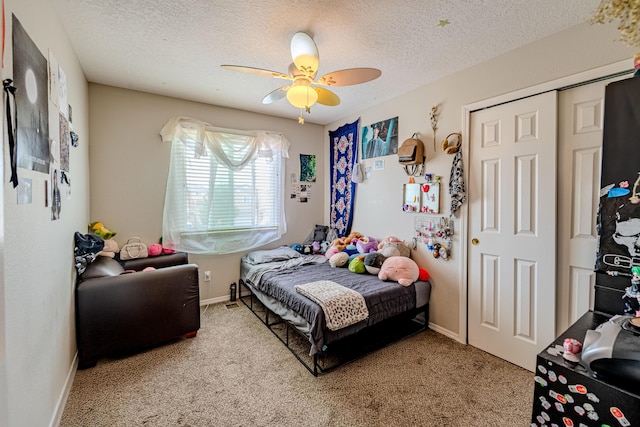 10500 Trieste Ct NW, Albuquerque, NM 87114 - carpeted bedroom with a textured ceiling, ceiling fan, baseboards, and a closet