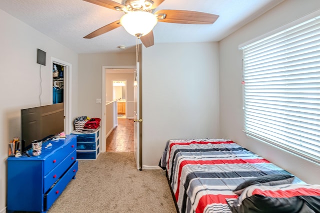 10500 Trieste Ct NW, Albuquerque, NM 87114 - bedroom featuring light carpet and a ceiling fan