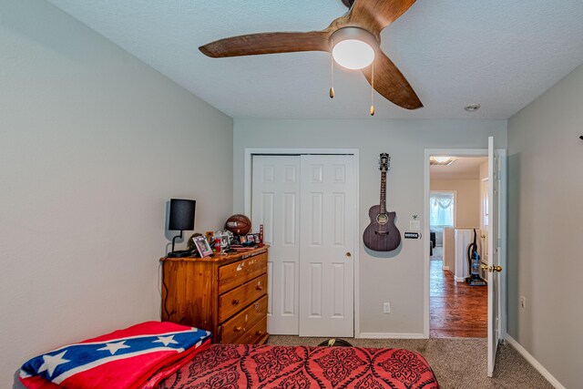 10500 Trieste Ct NW, Albuquerque, NM 87114 - carpeted bedroom with a closet, baseboards, and ceiling fan