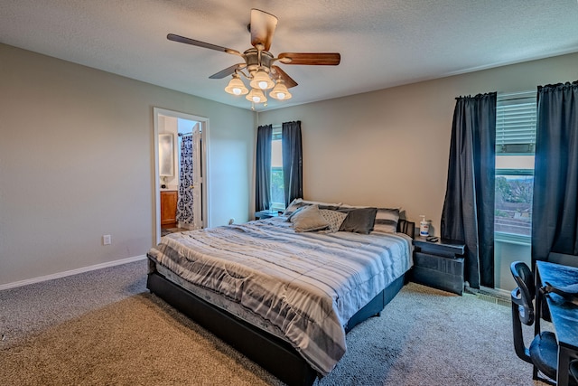 10500 Trieste Ct NW, Albuquerque, NM 87114 - bedroom with carpet flooring, baseboards, a textured ceiling, ceiling fan, and ensuite bath