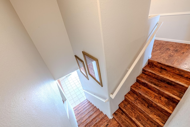 10500 Trieste Ct NW, Albuquerque, NM 87114 - staircase with wood finished floors and baseboards