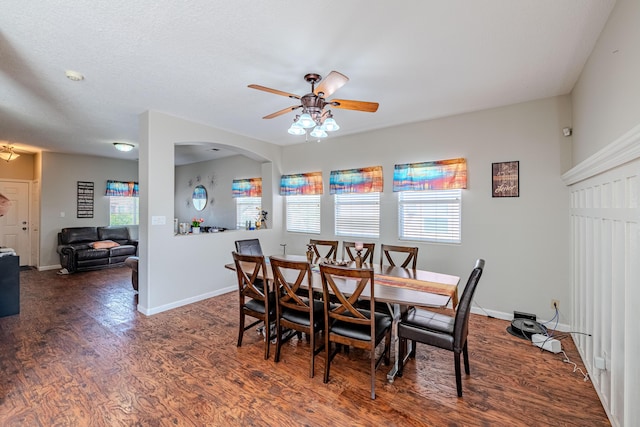 10500 Trieste Ct NW, Albuquerque, NM 87114 - dining area with wood finished floors, a ceiling fan, healthy amount of natural light, and baseboards