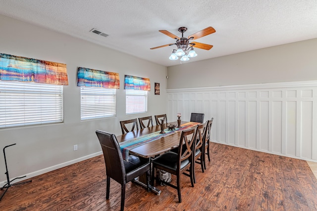 10500 Trieste Ct NW, Albuquerque, NM 87114 - dining space with wood finished floors, ceiling fan, and a textured ceiling