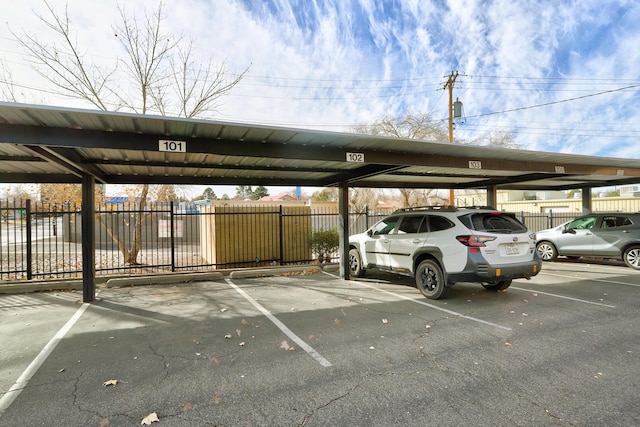 351 Washington St SE Unit 102, Albuquerque, NM 87108 - covered parking lot featuring fence