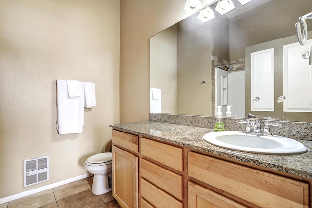 351 Washington St SE Unit 102, Albuquerque, NM 87108 - full bath featuring toilet, tile patterned floors, vanity, baseboards, and a shower