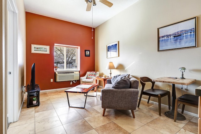351 Washington St SE Unit 102, Albuquerque, NM 87108 - living area with ceiling fan, cooling unit, baseboards, light tile patterned flooring, and a towering ceiling