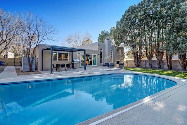 6507 Loftus Ave NE, Albuquerque, NM 87109 - view of pool featuring area for grilling, a patio area, and a fenced backyard