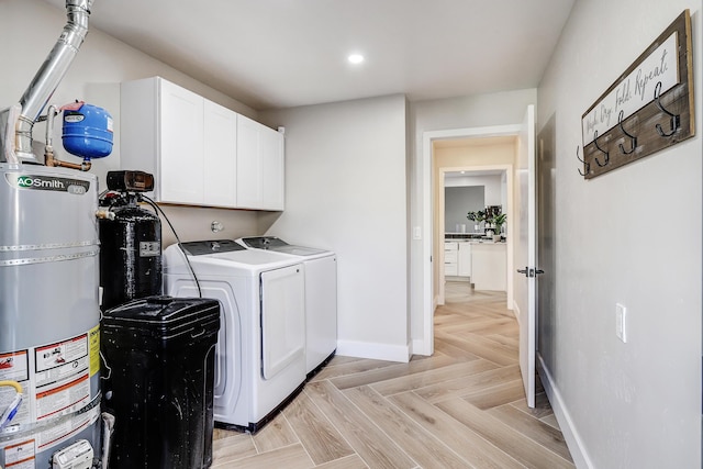 6507 Loftus Ave NE, Albuquerque, NM 87109 - laundry area with washing machine and dryer, cabinet space, water heater, baseboards, and recessed lighting