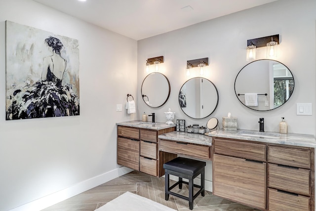 6507 Loftus Ave NE, Albuquerque, NM 87109 - bathroom featuring double vanity and baseboards