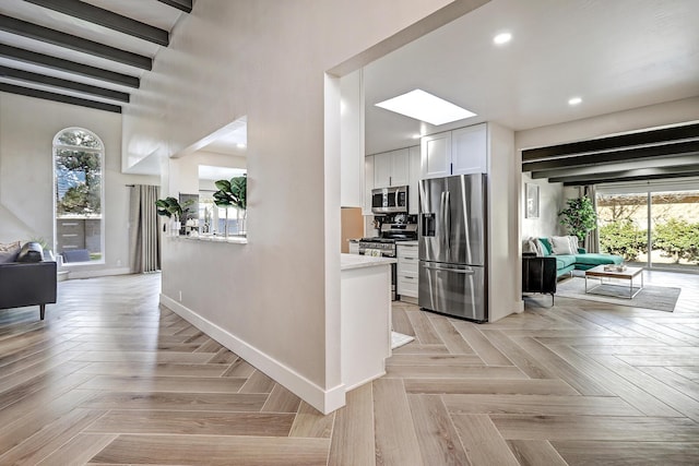6507 Loftus Ave NE, Albuquerque, NM 87109 - corridor featuring baseboards, recessed lighting, and a skylight