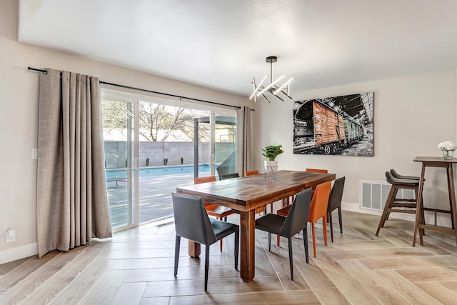 6507 Loftus Ave NE, Albuquerque, NM 87109 - dining room featuring a chandelier and baseboards