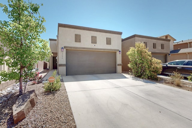 3136 Morrissey St SW, Albuquerque, NM 87121 - pueblo-style house with stucco siding, driveway, and a garage