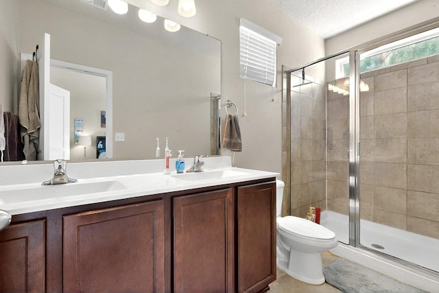 3136 Morrissey St SW, Albuquerque, NM 87121 - bathroom with a shower stall, double vanity, toilet, ensuite bath, and a textured ceiling