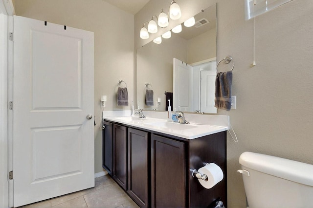 3136 Morrissey St SW, Albuquerque, NM 87121 - bathroom with toilet, tile patterned flooring, and double vanity