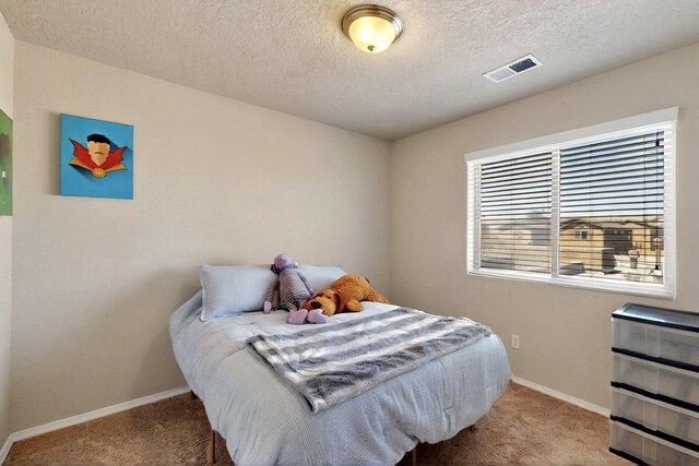 3136 Morrissey St SW, Albuquerque, NM 87121 - bedroom with carpet flooring, baseboards, and a textured ceiling