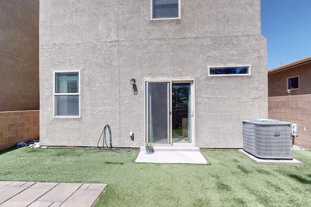 3136 Morrissey St SW, Albuquerque, NM 87121 - rear view of house with central AC unit and stucco siding