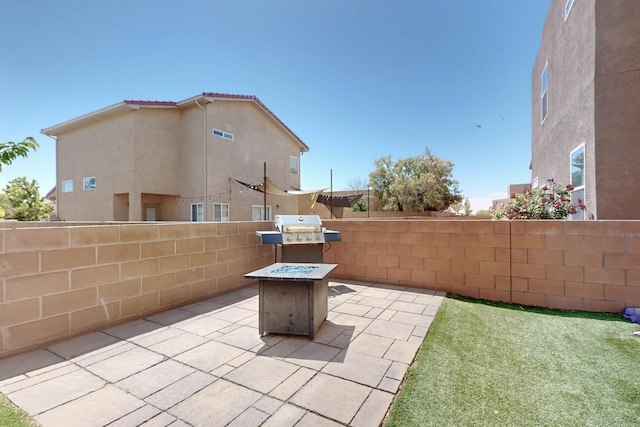 3136 Morrissey St SW, Albuquerque, NM 87121 - view of patio / terrace featuring a fenced backyard, an outdoor fire pit, and area for grilling