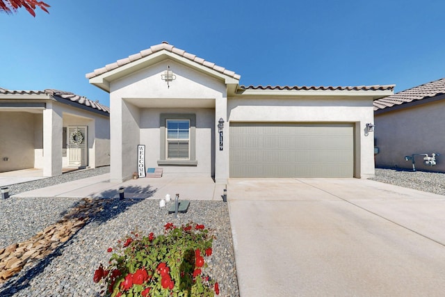 3179 Kunzita St SE, Rio Rancho, NM 87124 - mediterranean / spanish house featuring stucco siding, an attached garage, driveway, and a tile roof