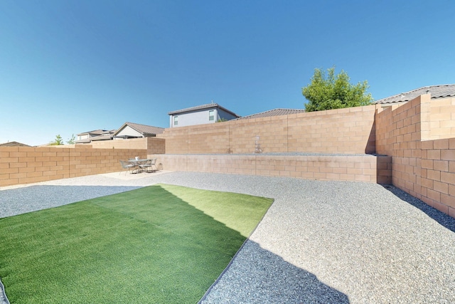 3179 Kunzita St SE, Rio Rancho, NM 87124 - fenced backyard with a patio