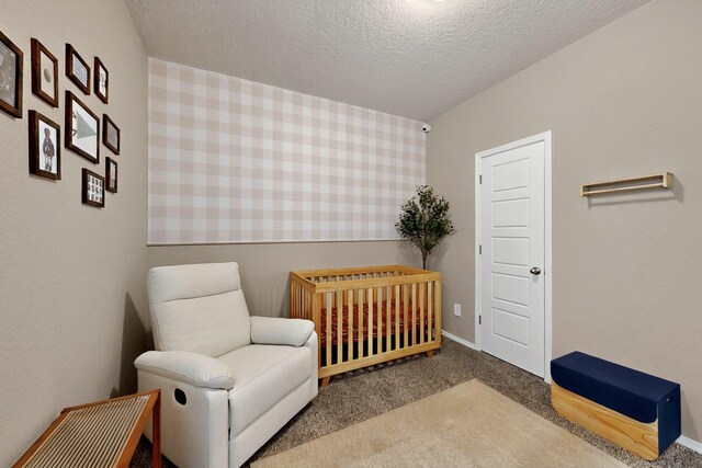 3179 Kunzita St SE, Rio Rancho, NM 87124 - bedroom with carpet floors, a nursery area, and a textured ceiling