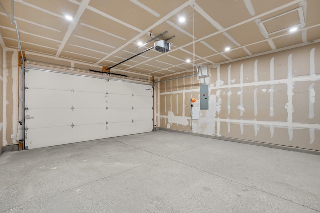4909 Calle Espana NW, Albuquerque, NM 87120 - garage featuring electric panel and a garage door opener