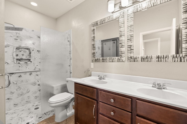 4909 Calle Espana NW, Albuquerque, NM 87120 - bathroom featuring a stall shower, toilet, and double vanity