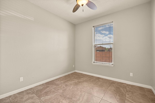 4909 Calle Espana NW, Albuquerque, NM 87120 - unfurnished room featuring ceiling fan, baseboards, and a textured ceiling