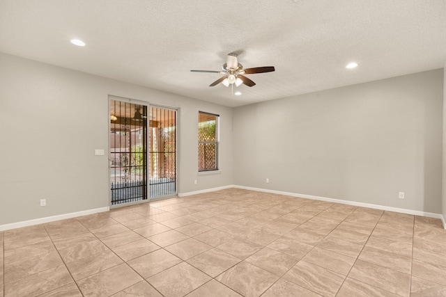 4909 Calle Espana NW, Albuquerque, NM 87120 - empty room featuring a ceiling fan, recessed lighting, light tile patterned floors, a textured ceiling, and baseboards