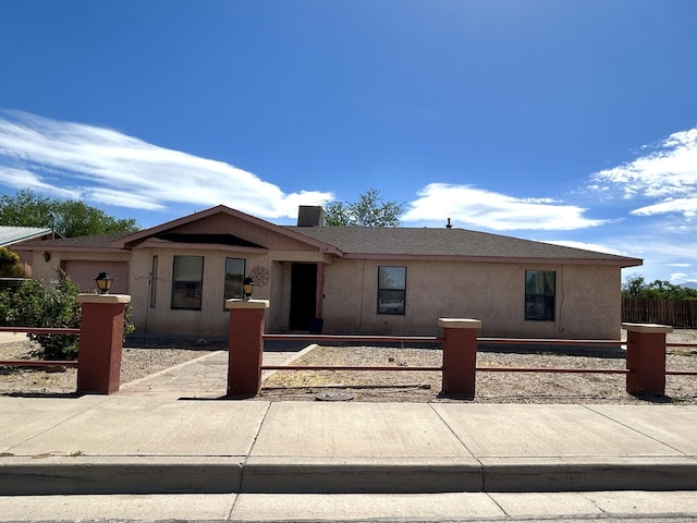 668 Helen Cir, Los Lunas, NM 87031 - single story home with a fenced front yard and stucco siding