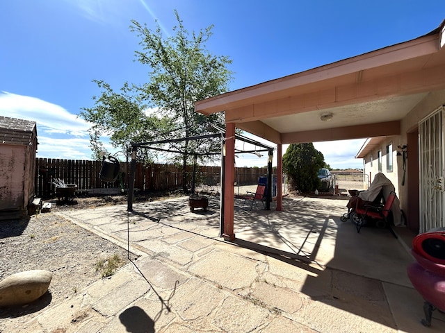 668 Helen Cir, Los Lunas, NM 87031 - view of patio featuring a fenced backyard