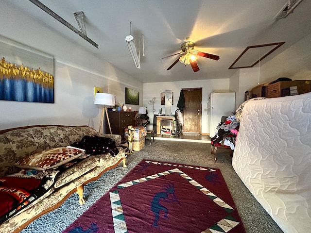 668 Helen Cir, Los Lunas, NM 87031 - carpeted bedroom with freestanding refrigerator and a ceiling fan