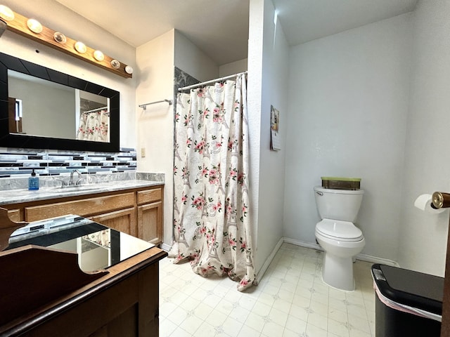 668 Helen Cir, Los Lunas, NM 87031 - full bath featuring tile patterned floors, toilet, vanity, curtained shower, and backsplash