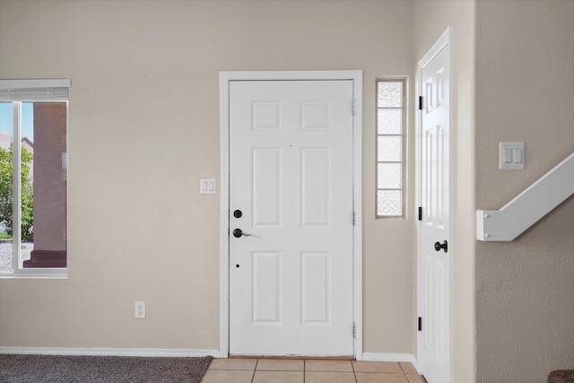 3129 Cochiti St NE, Rio Rancho, NM 87144 - foyer entrance with light tile patterned floors and baseboards