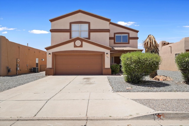 3129 Cochiti St NE, Rio Rancho, NM 87144 - view of front of home featuring stucco siding, driveway, and a garage