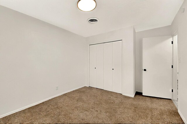 357 Meade Ct, Rio Communities, NM 87002 - unfurnished bedroom featuring carpet, a closet, and baseboards
