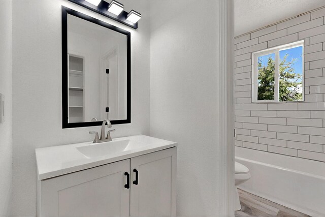 357 Meade Ct, Rio Communities, NM 87002 - bathroom with toilet, vanity, and wood finished floors