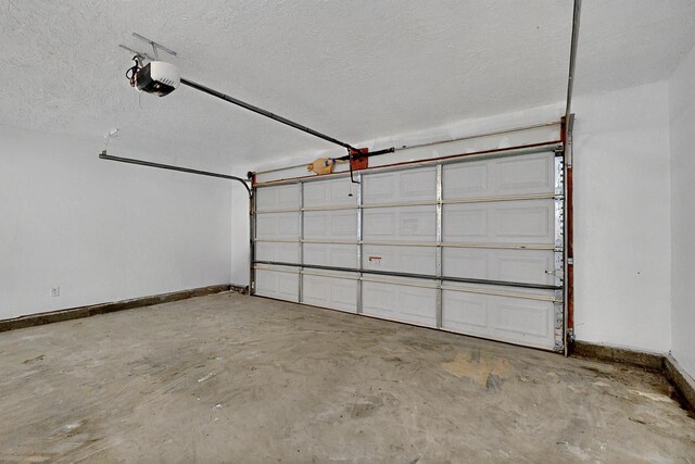 357 Meade Ct, Rio Communities, NM 87002 - garage featuring a garage door opener and baseboards