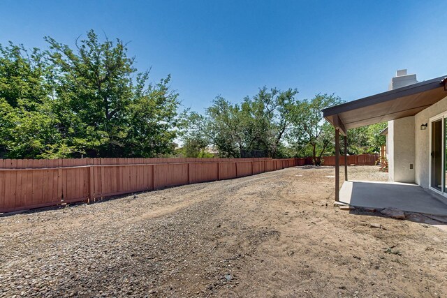 357 Meade Ct, Rio Communities, NM 87002 - fenced backyard with a patio area
