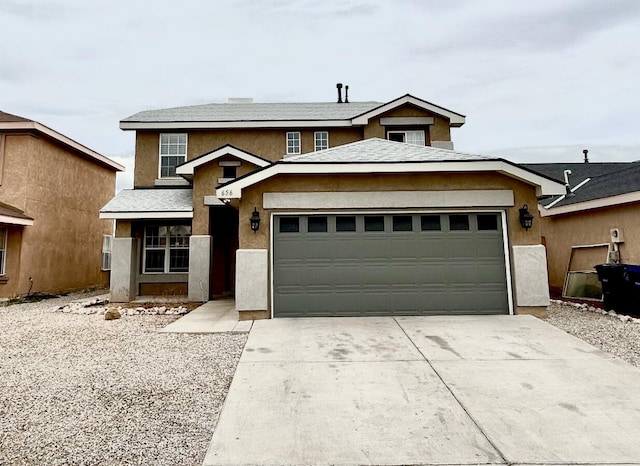 656 Cottontail St SW, Albuquerque, NM 87121 - traditional-style home with stucco siding, a garage, and concrete driveway