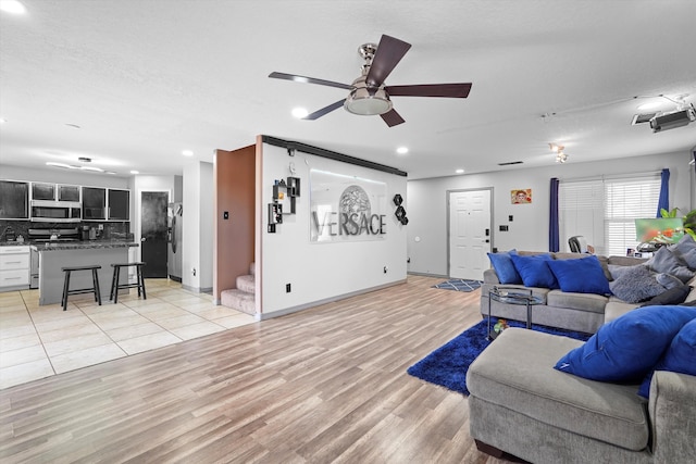 656 Cottontail St SW, Albuquerque, NM 87121 - living room with ceiling fan, light wood-type flooring, stairway, recessed lighting, and baseboards