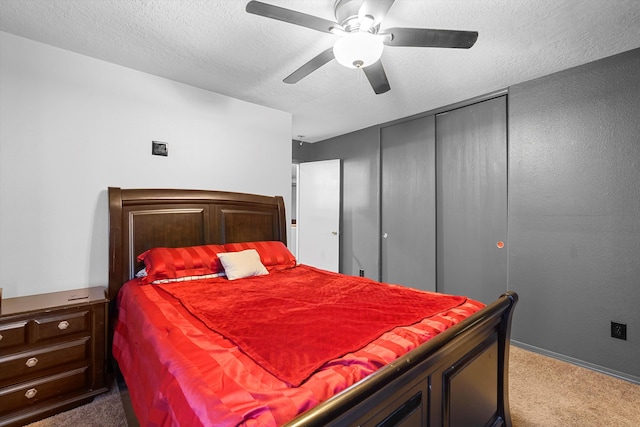 656 Cottontail St SW, Albuquerque, NM 87121 - bedroom with carpet flooring, a closet, a textured ceiling, baseboards, and a ceiling fan