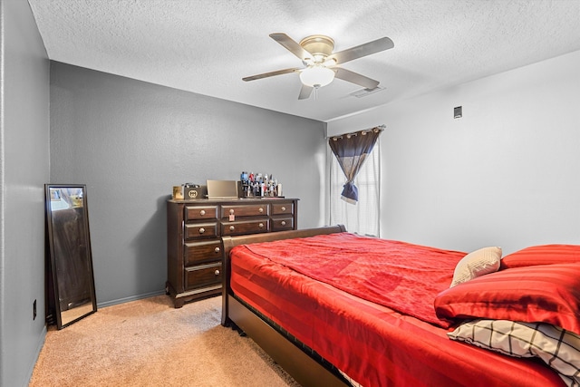 656 Cottontail St SW, Albuquerque, NM 87121 - bedroom with light colored carpet, a textured ceiling, ceiling fan, and baseboards