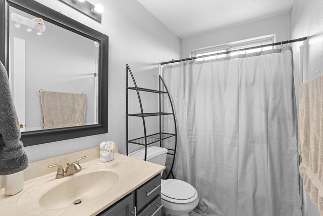 656 Cottontail St SW, Albuquerque, NM 87121 - full bath with toilet, vanity, and curtained shower