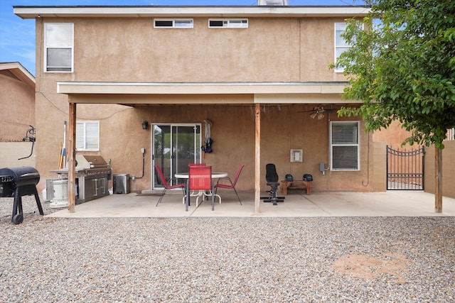 656 Cottontail St SW, Albuquerque, NM 87121 - back of property featuring stucco siding and a patio area