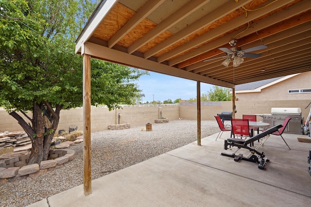 656 Cottontail St SW, Albuquerque, NM 87121 - view of patio featuring a fenced backyard, area for grilling, outdoor dining area, and ceiling fan